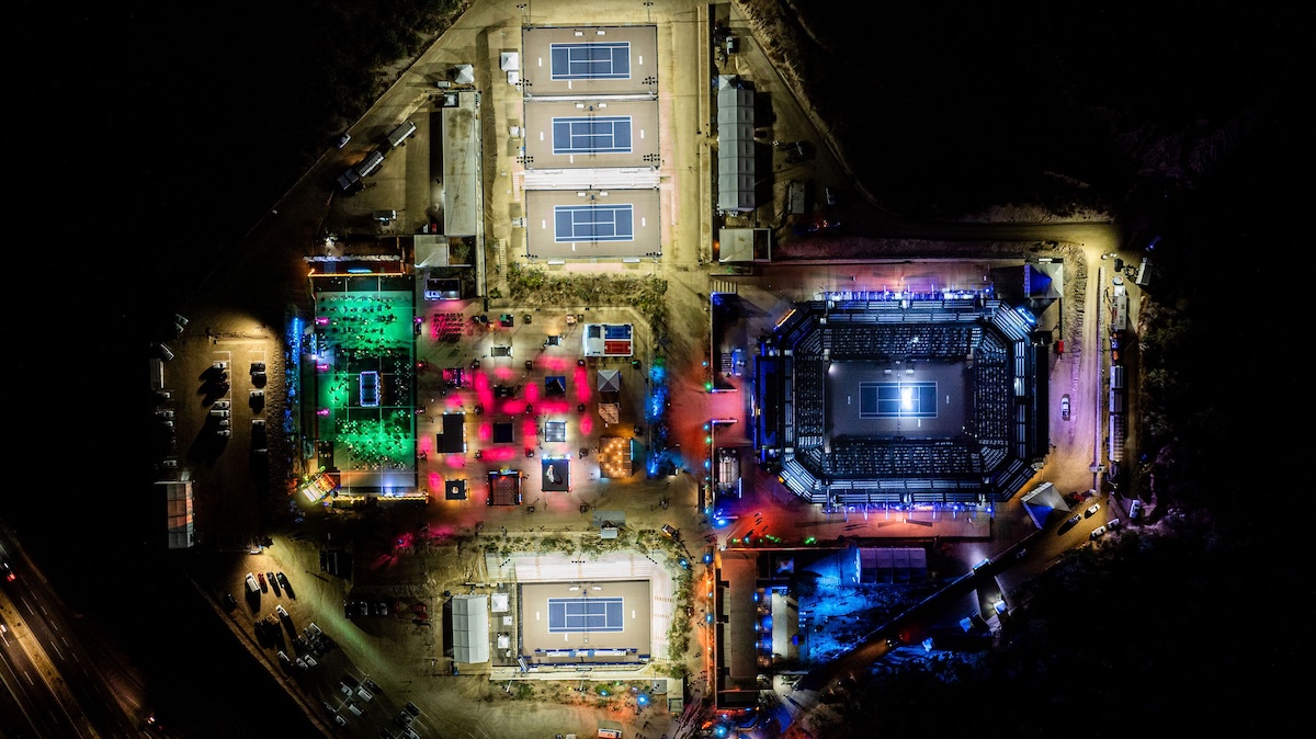 A spectacular aerial view of the Cabo Sports Complex lit up for tournament week. Image Credit: Mextenis