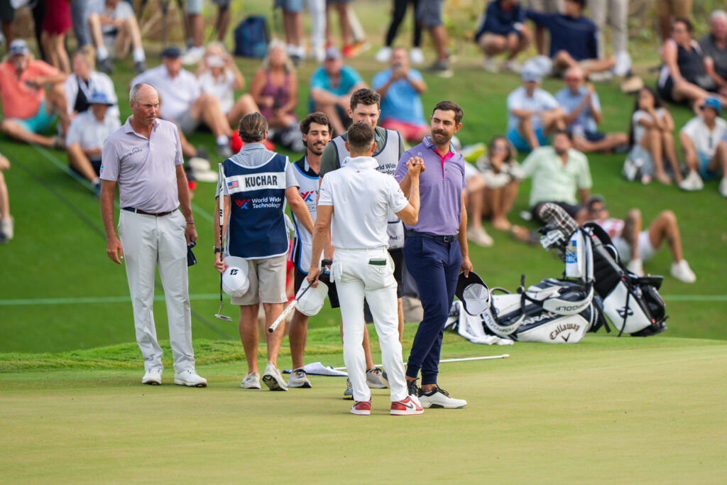 Erik van Rooyen, 2023 World Wide Technology Championship winner, shares a moment of sportsmanship as he closes on the green. Image Credit: World Wide Technology Championship.