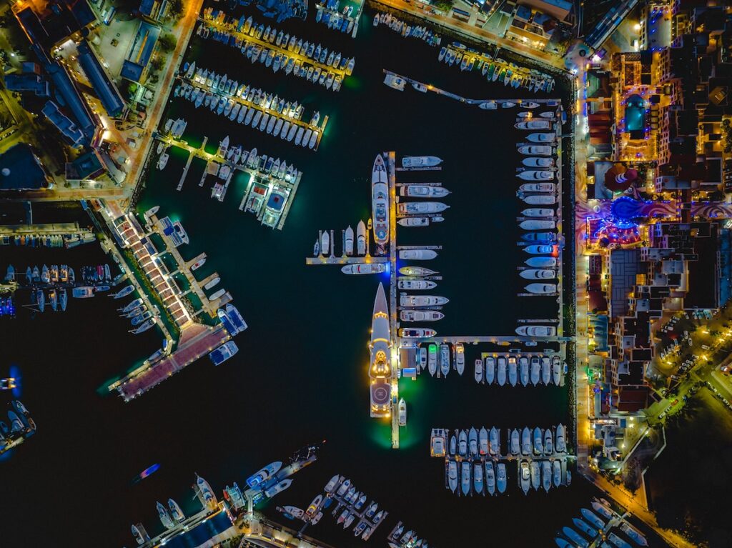 Illuminated vessels glide through the Cabo San Lucas marina during the annual Nautical Christmas Parade, transforming the harbor into a shimmering celebration of coastal holiday tradition. Image credit: Shutterstock