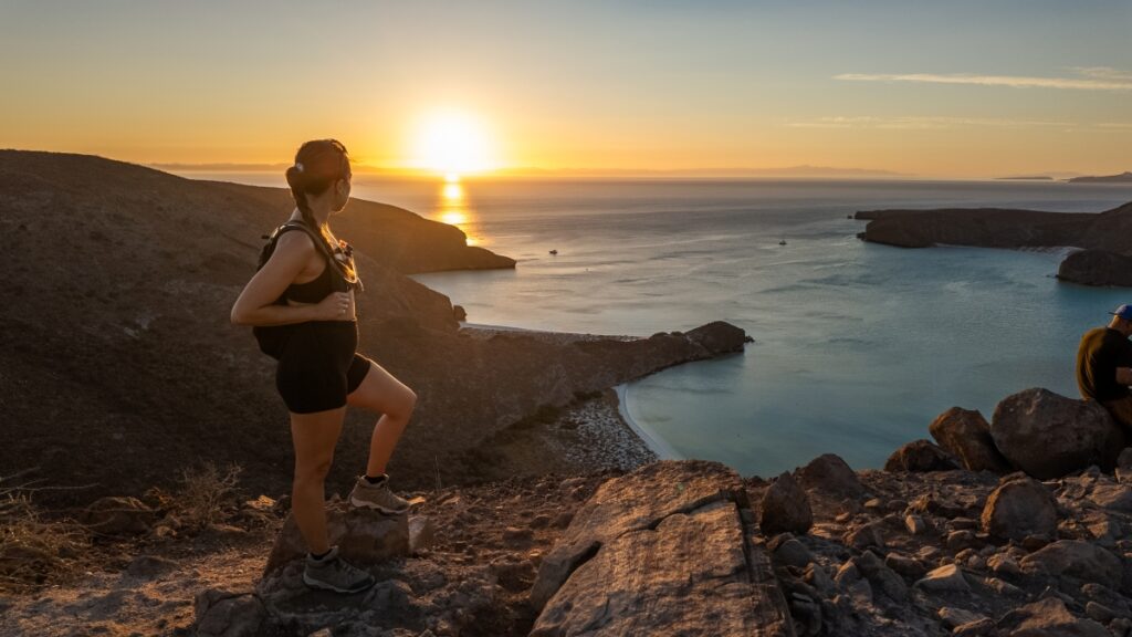 Playa Balandra at golden hour—tranquil, protected waters and sweeping views that define one of Baja California Sur’s most iconic natural settings. Image Credit: Shutterstock